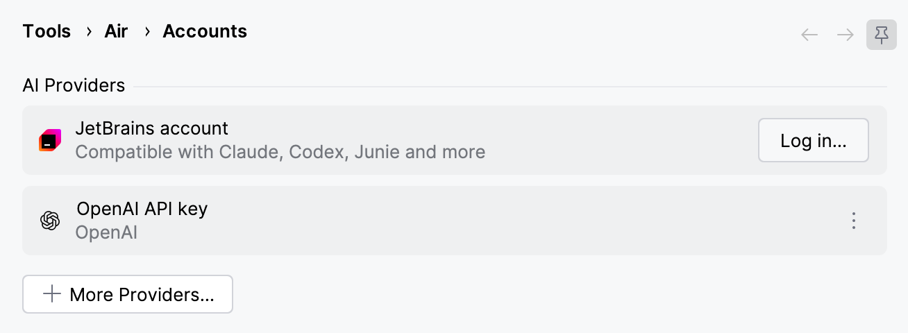 Accounts settings with the logged-out JetBrains account entry and its Log in button above a configured OpenAI API key entry. Accounts settings with the logged-out JetBrains account entry and its Log in button above a configured OpenAI API key entry.